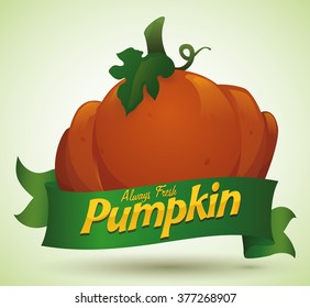 Fresh shiny pumpkin and a green ribbon with golden message in soft green background.