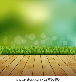 Fresh spring green grass with bokeh and sunlight and wooden floor