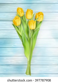 Fresh spring yellow tulips flowers on turquoise wooden planks. Selective focus. Place for text. EPS 10 vector file included