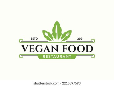 Fresh vegetable leaf with spoon, fork, knife. Vintage vegan restaurant bar bistro logo design template