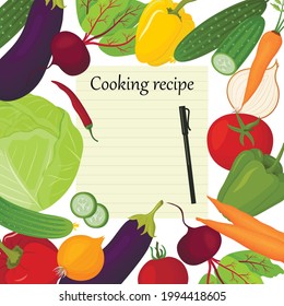 Fresh vegetables and paper for recipe notes. Cabbage, eggplant, carrots, sweet peppers and other products. Vegetarian food.