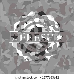 Fresh written on a grey camouflage texture