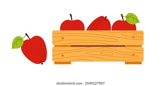 Frisch geerntete Äpfel in einer Holzkiste mit grünen Blättern an einem sonnigen Tag