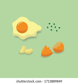 Fried egg, garlic, spring onion, eggshell on a green background