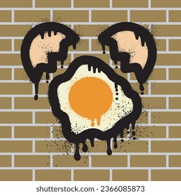 Fried egg graffiti with spray paint on brick wall background