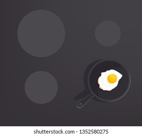 fried egg on black pan on cooker