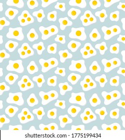 Fried eggs on a blue background, Seamless pattern.