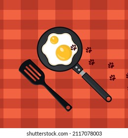 Fried eggs on the table with cat footprints