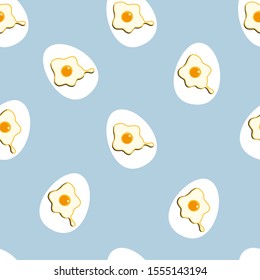 Fried eggs seamless pattern on blue background. Vector illustration.
