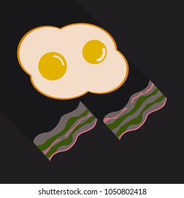 Fried eggs and slices of crisp bacon