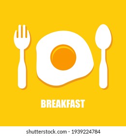 Fried eggs, spoon and fork - breakfast