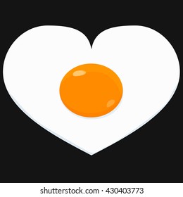 fried scrambled egg in the shape of a heart on black pan
