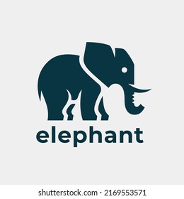 Friendly elephant Logo. Wild animal tusk and trunk icon. Simple african wildlife symbol. Vector illustration.