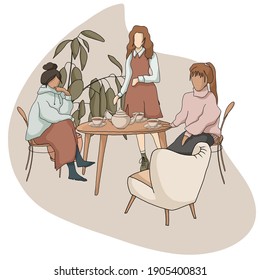 Friendly girls talking in cafe