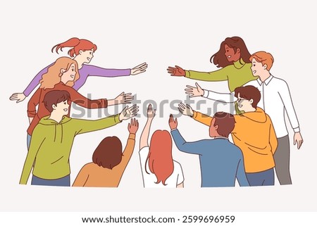 Friendly multicultural people reach out to each other, demonstrating unity and readiness to create single community. Multicultural men and women uniting and demonstrating lidarity or cooperation