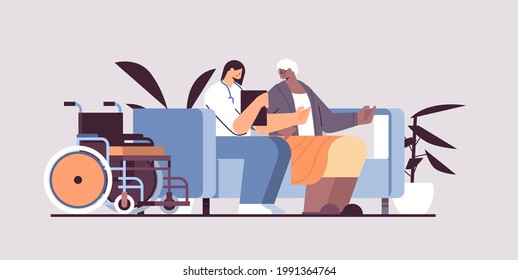 friendly nurse or volunteer supporting elderly woman home care services healthcare and social support