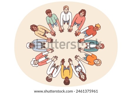 Friendly people stand in circle hold hands for collaboration and teamwork, top view. University students of different gender and race get education together while studying in college