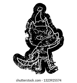friendly quirky cartoon distressed icon of a wolf giving peace sign wearing santa hat