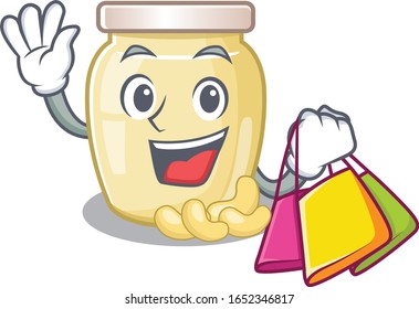A friendly rich cashew butter waving and holding Shopping bag