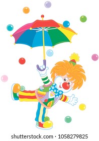 Friendly smiling circus clown dancing under a colorful umbrella in rain of color balls, a vector illustration in a cartoon style