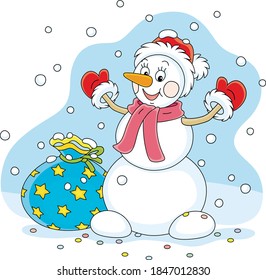 Friendly smiling funny snowman with a red hat, a warm scarf and mittens brought a big bag of Christmas gifts for little kids on a snowy winter day, vector cartoon illustration