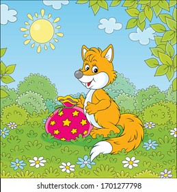 Friendly smiling red fox holding a beautiful bag with a holiday gift on green grass of a pretty forest glade on a sunny summer day, vector cartoon illustration