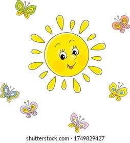 Friendly smiling sun playing with cheerful colorful butterflies flittering around on a pretty summer day, vector cartoon illustration on a white background