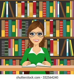 friendly student girl with glasses happy studying in library reading a textbook