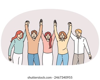 Friendly team holding hands and smiling for concept of successful collaboration to achieve ambitious goals. Team of students or colleagues from men and women rejoice at completion of joint project