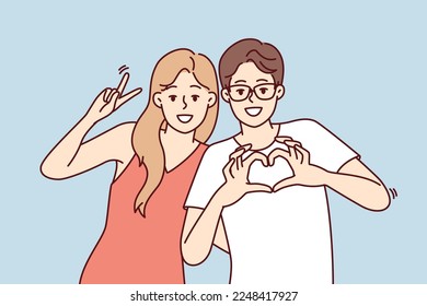 Friendly young man and woman stand in embrace and smiling looking at camera. Guy and girl in casual clothes show different gestures while posing for friendly photo. Flat vector illustration 