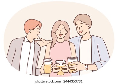 Friends drink beer and laugh enjoying socializing and friendly conversation during oktoberfest or friday party. Girl and guys with glasses of beer are relaxing in bar sharing funny stories