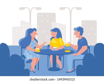 Friends drinking coffee in an outdoor cafe. Group of happy people sitting, talking, hold cups of tea are smiling. Man and women together in restaurant on urban landscape. Business lunch, coffee break