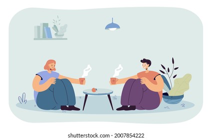 Friends drinking tea at home flat vector illustration. Two people sitting on floor at coffee table and holding cups of hot drink. Communication, friendship, drinking, home gatherings concept