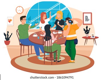 Friends are having rest at home. People spend time in different ways with board games on the table. Young characters have a great time together. Photographer takes pictures of people playing