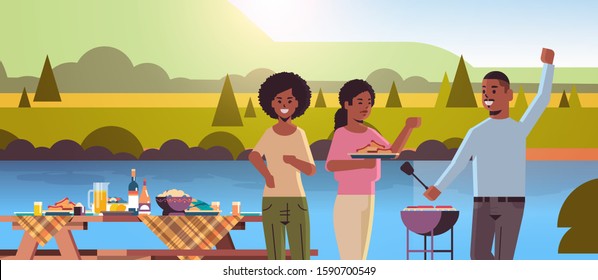 friends preparing hot dogs on grill african american man and women having fun picnic barbecue party concept park or river bank landscape background flat portrait horizontal vector illustration