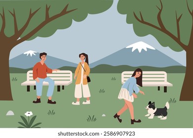 Friends Relaxing in the Park. Couple dating in the park. Woman with her dog playing in the park. Summer activity. Spring time. Holiday time. Park activity.