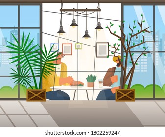 Friends are sitting in cafe or restaurant at a table eating and drinking. Cheerful men in glasses having fun, talking, communicating. Meeting good friends. View from the street through a large window