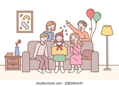 Friends are sitting together on the sofa in the living room and celebrating a birthday. flat design style vector illustration.