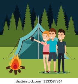 friends with smartphones in the camping zone