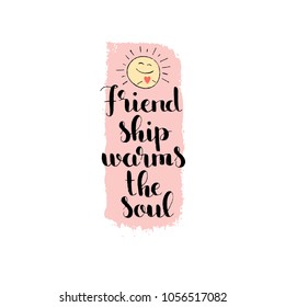 Friendship warms the soul handwritten lettering. Happy Friendship Day. Modern vector hand drawn calligraphy with smiling sun and brush painted texture isolated on white background for your design