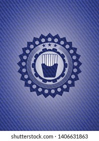 fries icon inside emblem with jean background