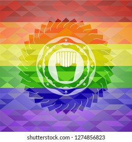 fries icon inside emblem on mosaic background with the colors of the LGBT flag