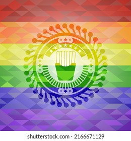 fries icon inside emblem on mosaic background with the colors of the LGBT flag. 