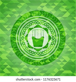 fries icon inside green emblem with triangle mosaic background