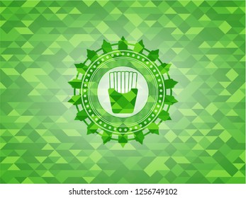  fries icon inside green emblem. Mosaic background