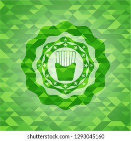 fries icon inside green emblem. Mosaic background