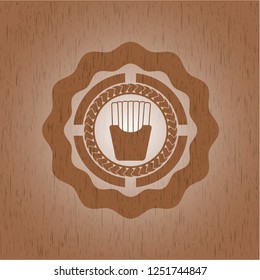 fries icon inside wood badge or emblem
