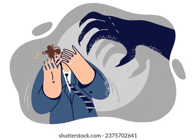 Frightened business man near giant shadow with monster hand, for concept fears of financial crisis. Panicking business guy crying and covering face with eyes feeling afraid of problems