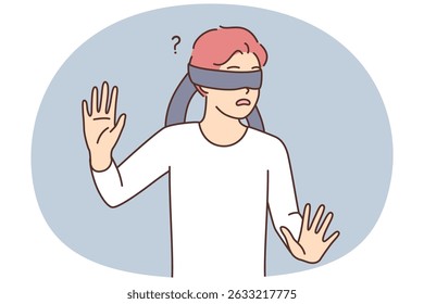 Frightened casual teen boy blindfolded trying to grope road of action in blind. Frightened schoolboy is confused while playing hide-and-seek or entertaining quest