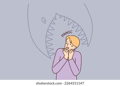 Frightened man having panic attack imagining giant fish trying to eat him. Cowardly guy panic and gets scared after watching horror movies or reading scary stories in books svg